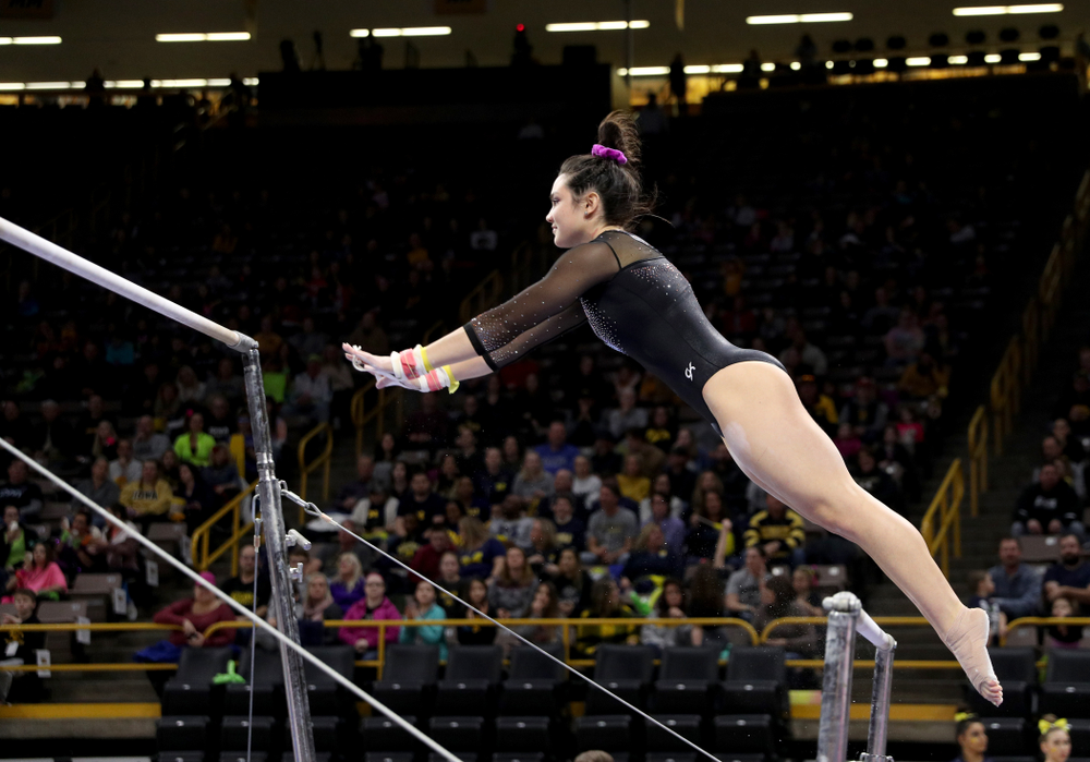 Iowa’s Carina Tolan competes on the bars against Michigan Friday, February 14, 2020 at Carver-Hawkeye Arena. (Brian Ray/hawkeyesports.com)