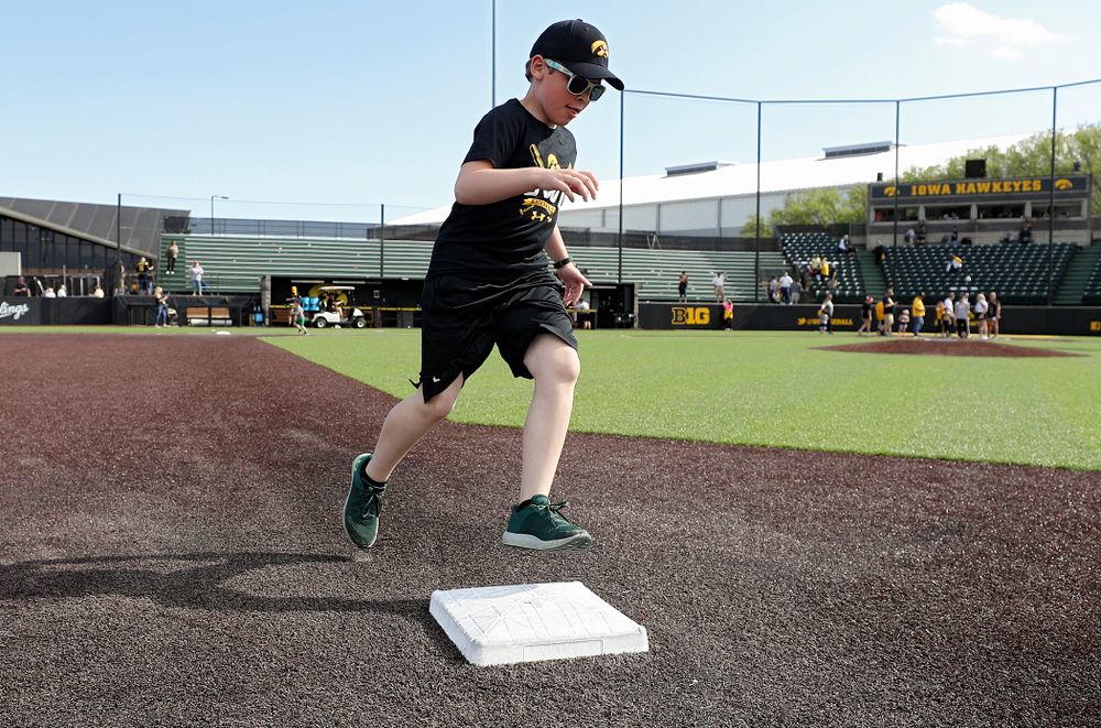 Kids run the bases after Iowa's game against UC Irvine at Duane Banks Field in Iowa City on Sunday, May. 5, 2019. (Stephen Mally/hawkeyesports.com)