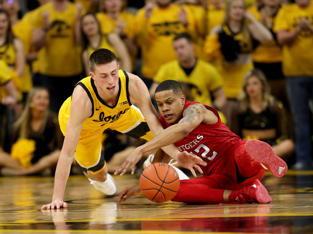 Iowa Hawkeyes guard Joe Wieskamp (10) battles for a loose ball against the Rutgers Scarlet Knights Wednesday, January 22, 2020 at Carver-Hawkeye Arena. (Brian Ray/hawkeyesports.com)