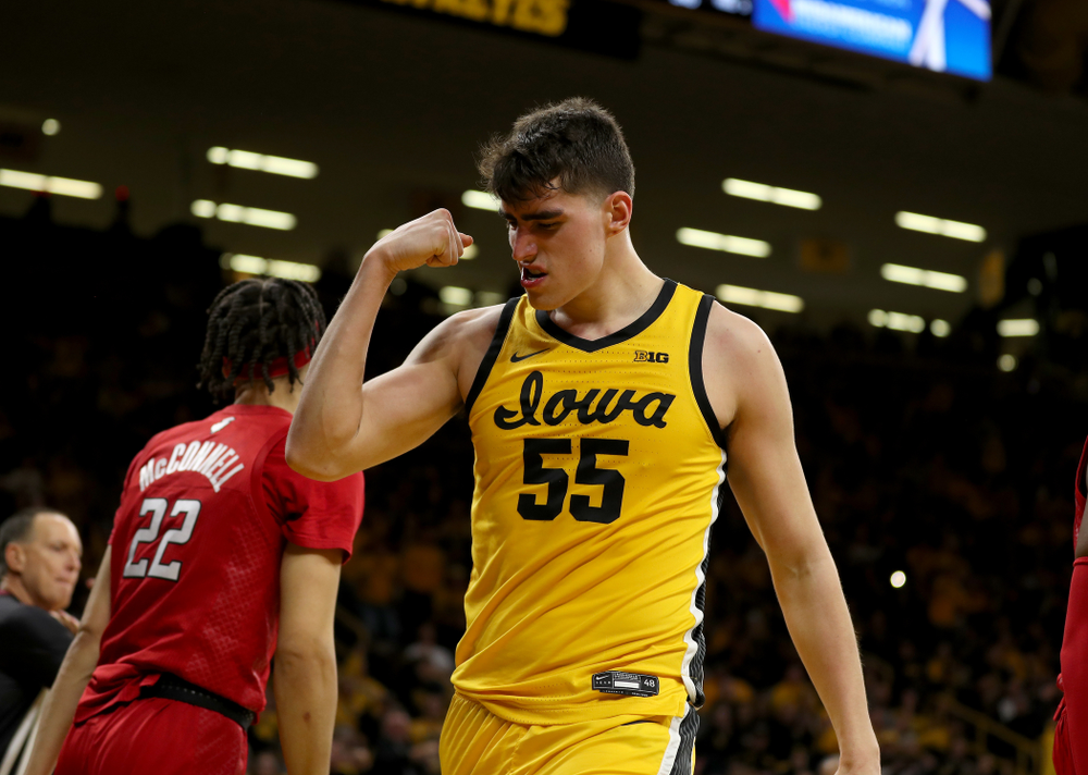 Iowa Hawkeyes forward Luka Garza (55) flexes after making a basket and drawing a foul against the Rutgers Scarlet Knights Wednesday, January 22, 2020 at Carver-Hawkeye Arena. (Brian Ray/hawkeyesports.com)
