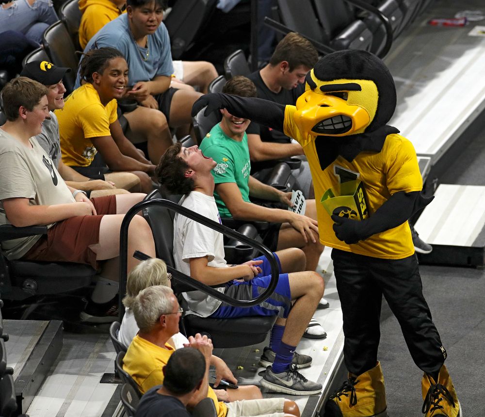 Herky tries to feed popcorn to a fan during the second set of their Big Ten/Pac-12 Challenge match against Colorado at Carver-Hawkeye Arena in Iowa City on Friday, Sep 6, 2019. (Stephen Mally/hawkeyesports.com)