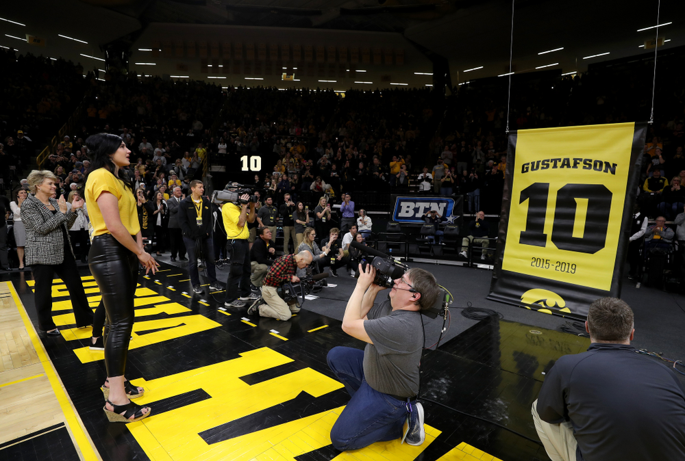 Megan Gustafson wipes away a tear as her number is raised into the rafters during a jersey retirement ceremony Sunday, January 26, 2020 at Carver-Hawkeye Arena. (Brian Ray/hawkeyesports.com)