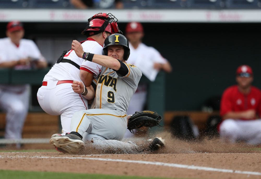 Iowa Hawkeyes outfielder Ben Norman (9) scores against the Indiana Hoosiers in the first round of the Big Ten Baseball Tournament Wednesday, May 22, 2019 at TD Ameritrade Park in Omaha, Neb. (Brian Ray/hawkeyesports.com)