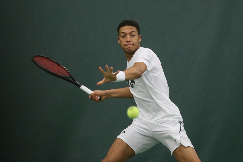 Iowa’s Oliver Okonkwo returns a hit during the Iowa men’s tennis meet vs Nebraska on Sunday, March 1, 2020 at the Hawkeye Tennis and Recreation Complex. (Lily Smith/hawkeyesports.com)