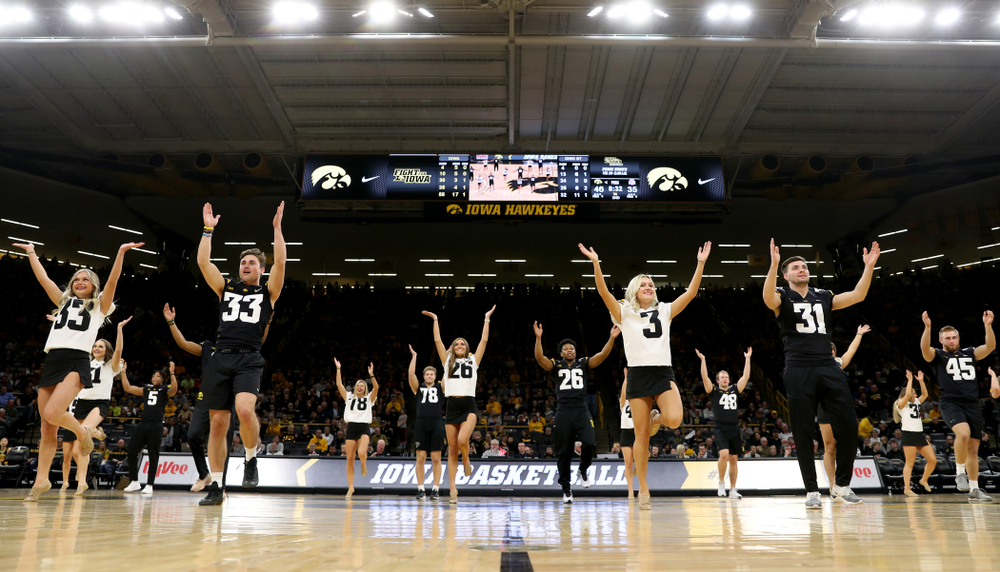 Members of the Hawkeye Football team performs with the Iowa Dance Team at halftime of the Iowa Hawkeyes game against the Ohio State Buckeyes Thursday, February 20, 2020 at Carver-Hawkeye Arena. (Brian Ray/hawkeyesports.com)