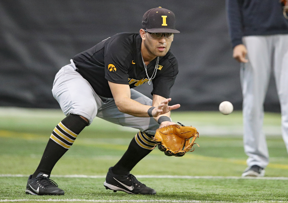 Iowa Hawkeyes infielder Matthew Sosa (31) fields a ball during practice at the Hansen Football Performance Center in Iowa City on Friday, January 24, 2020. (Stephen Mally/hawkeyesports.com)