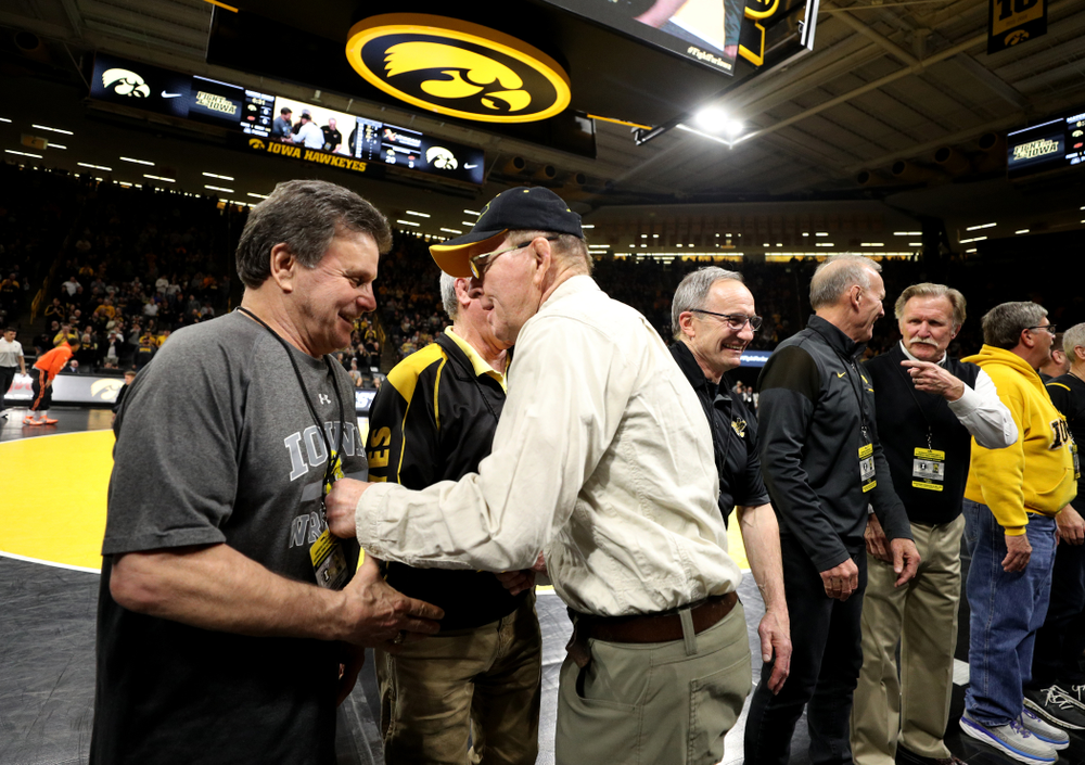 Legendary former head coach Dan Gable shakes hands with Iowa Wrestling alumni during the Iowa Hawkeyes dual against Oklahoma State Sunday, February 23, 2020 at Carver-Hawkeye Arena. (Brian Ray/hawkeyesports.com)