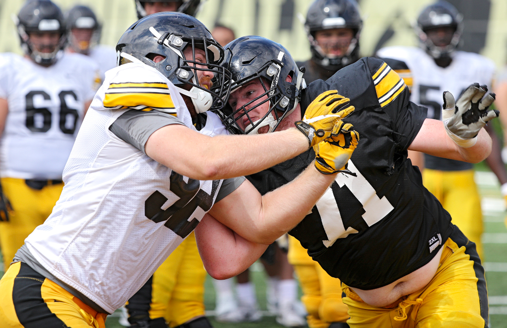 Iowa Hawkeyes defensive lineman John Waggoner (92) and offensive lineman Mark Kallenberger (71) run a drill during Fall Camp Practice No. 11 at the Hansen Football Performance Center in Iowa City on Wednesday, Aug 14, 2019. (Stephen Mally/hawkeyesports.com)