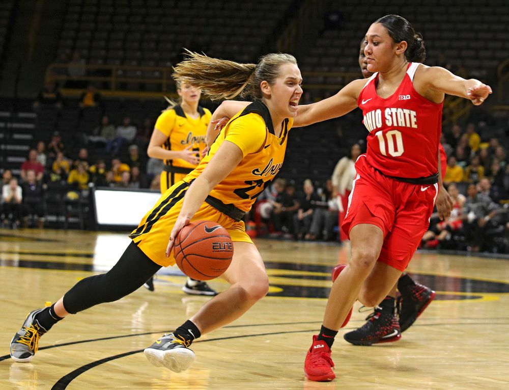 Iowa Hawkeyes guard Kathleen Doyle (22) drives on Ohio State Buckeyes guard Braxtin Miller (10) during the third quarter of their game at Carver-Hawkeye Arena in Iowa City on Thursday, January 23, 2020. (Stephen Mally/hawkeyesports.com)