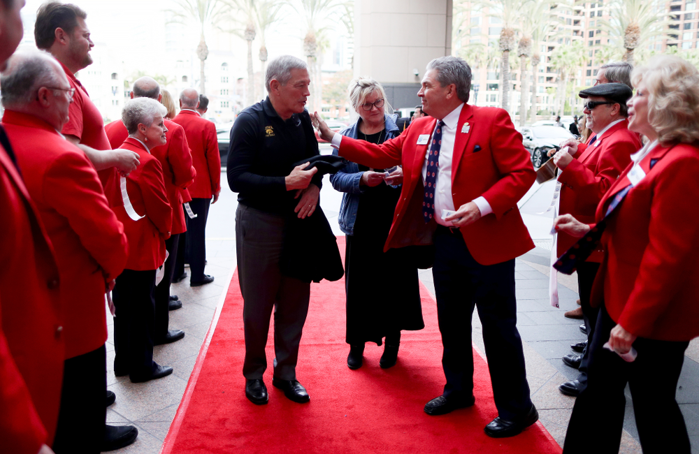 Iowa Hawkeyes head coach Kirk Ferentz shakes hands with the ÒRed CoatsÓ after arriving in San Diego, CA Saturday, December 21, 2019 for the Holiday Bowl. (Brian Ray/hawkeyesports.com)