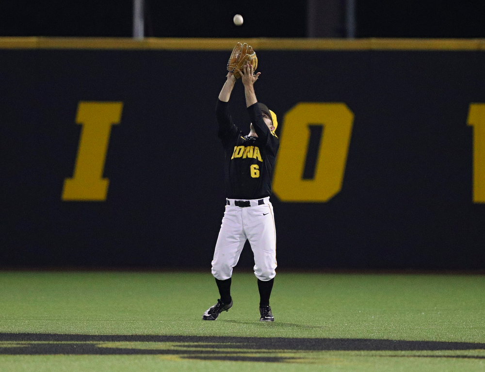 Iowa Hawkeyes center fielder Justin Jenkins (6) pulls in a fly ball for an out during the ninth inning of their game against Western Illinois at Duane Banks Field in Iowa City on Wednesday, May. 1, 2019. (Stephen Mally/hawkeyesports.com)