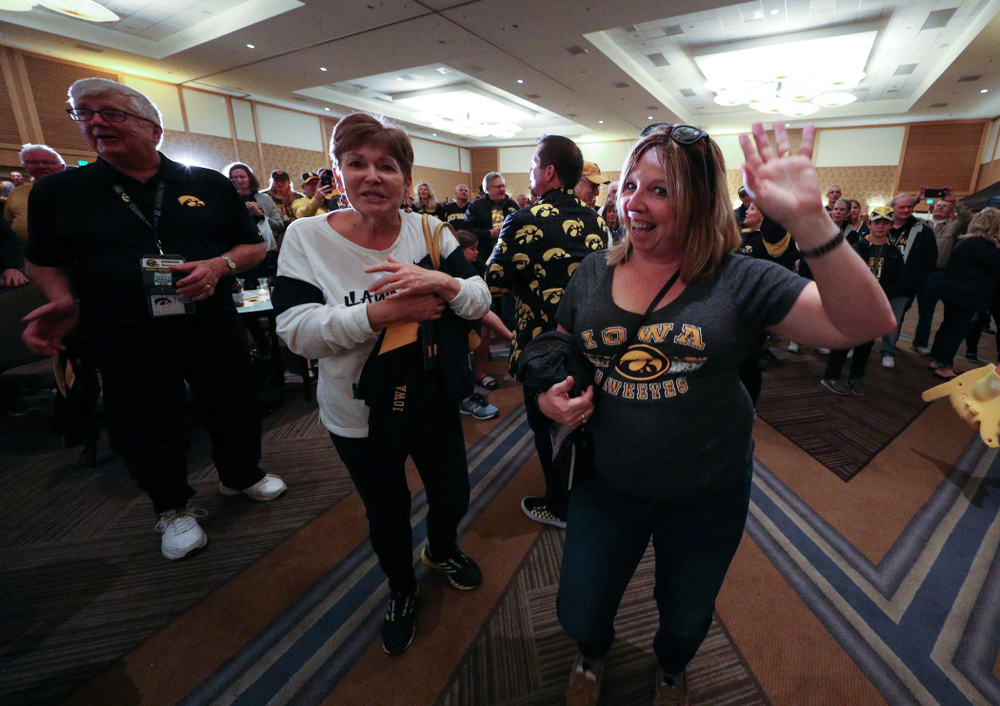 Fans dance to the Hokey Pokey in honor of the late Hayden Fry during the Holiday Bowl Hawkeye Huddle Thursday, December 26, 2019 at the Hilton in downtown San Diego. (Brian Ray/hawkeyesports.com)