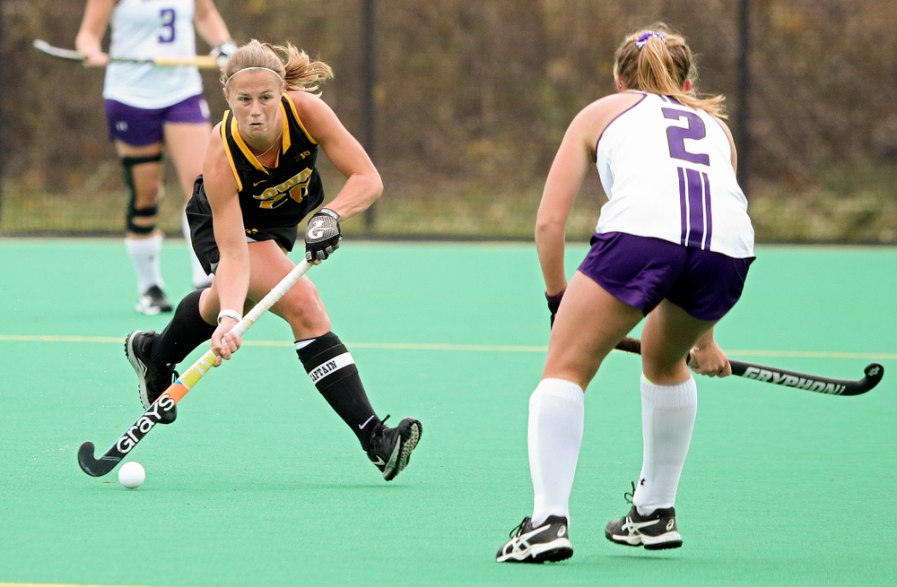 Iowa’s Sophie Sunderland (20) looks to pass during the first quarter of their game at Grant Field in Iowa City on Saturday, Oct 26, 2019. (Stephen Mally/hawkeyesports.com)