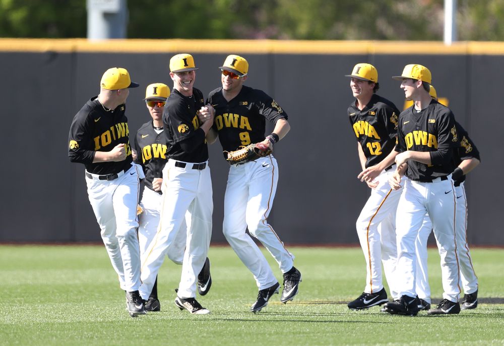 Iowa Hawkeyes Shane Ritter (18) and outfielder Ben Norman (9) celebrate after winning game two against UC Irvine Saturday, May 4, 2019 at Duane Banks Field. (Brian Ray/hawkeyesports.com)