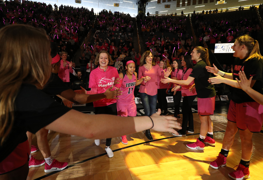 Iowa Hawkeyes guard Tania Davis (11) is introduced with a cancer survivor before their game against the seventh ranked Maryland Terrapins Sunday, February 17, 2019 at Carver-Hawkeye Arena. (Brian Ray/hawkeyesports.com)