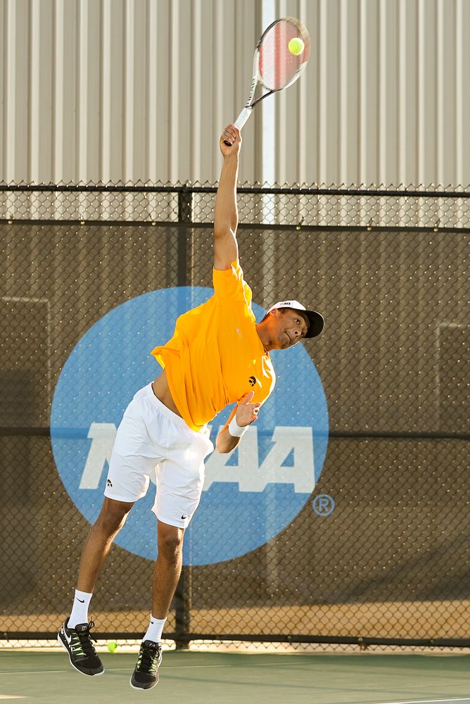 Iowa's Oliver Okonkwo serves during their doubles match again Michigan State at the Hawkeye Tennis and Recreation Complex in Iowa City on Friday, Apr. 19, 2019. (Stephen Mally/hawkeyesports.com)