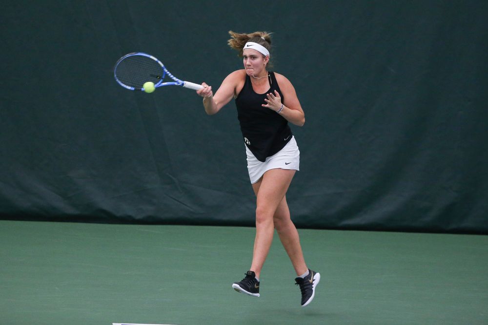 Iowa’s Ashleigh Jacobs returns a hit during the Iowa women’s tennis meet vs DePaul on Friday, February 21, 2020 at the Hawkeye Tennis and Recreation Complex. (Lily Smith/hawkeyesports.com)