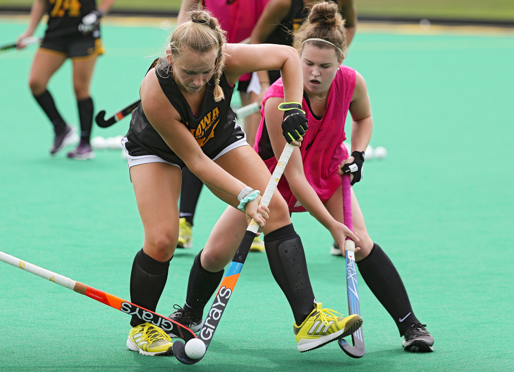 Iowa’s Katie Birch (11) and Meghan Conroy (5) run a drill during practice at Grant Field in Iowa City on Thursday, Aug 15, 2019. (Stephen Mally/hawkeyesports.com)