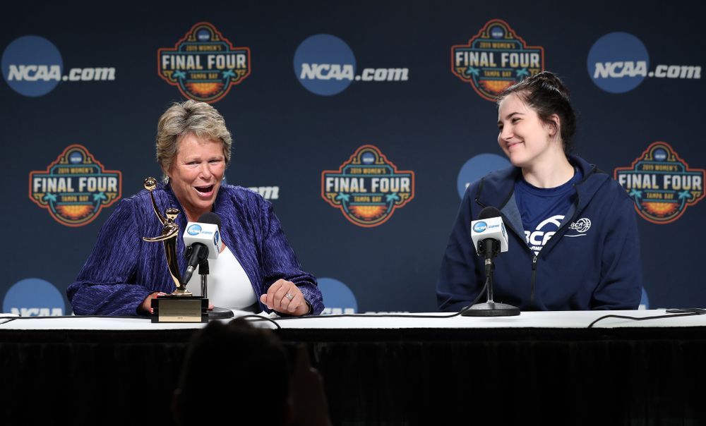 Iowa Hawkeyes forward Megan Gustafson (10) receives US Basketball Writers Association Ann Meyers Drysdale Player of the Year award from Ann Meyers Drysdale during a news conference Friday, April 5, 2019 at Amalie Arena in Tampa, FL. (Brian Ray/hawkeyesports.com)