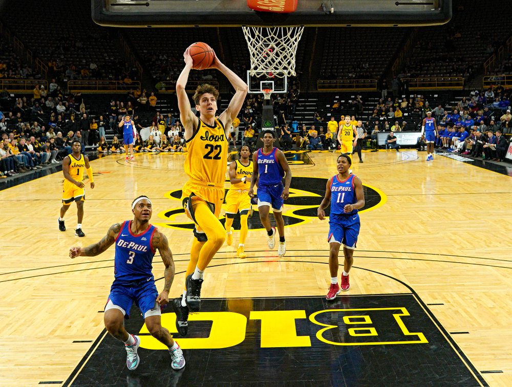 Iowa Hawkeyes forward Patrick McCaffery (22) dunks the ball during the second half of their game at Carver-Hawkeye Arena in Iowa City on Monday, Nov 11, 2019. (Stephen Mally/hawkeyesports.com)