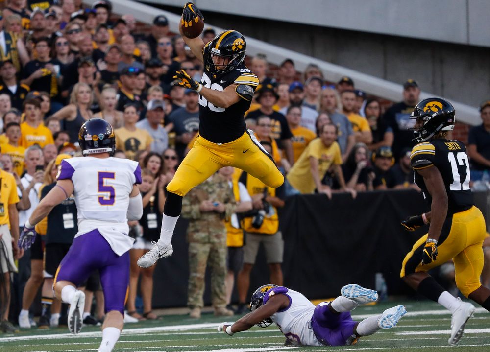 Iowa Hawkeyes tight end T.J. Hockenson (38) hurdles a defender during a game against Northern Iowa at Kinnick Stadium on September 15, 2018. (Tork Mason/hawkeyesports.com)