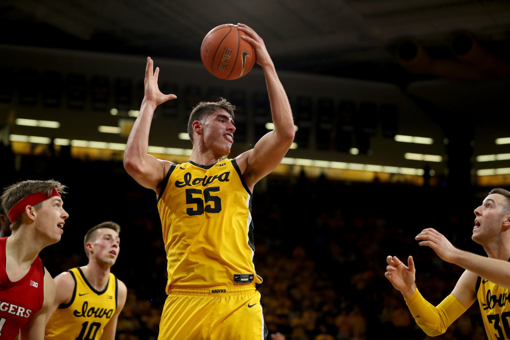 Iowa Hawkeyes forward Luka Garza (55) grabs a rebound against the Rutgers Scarlet Knights Wednesday, January 22, 2020 at Carver-Hawkeye Arena. (Brian Ray/hawkeyesports.com)