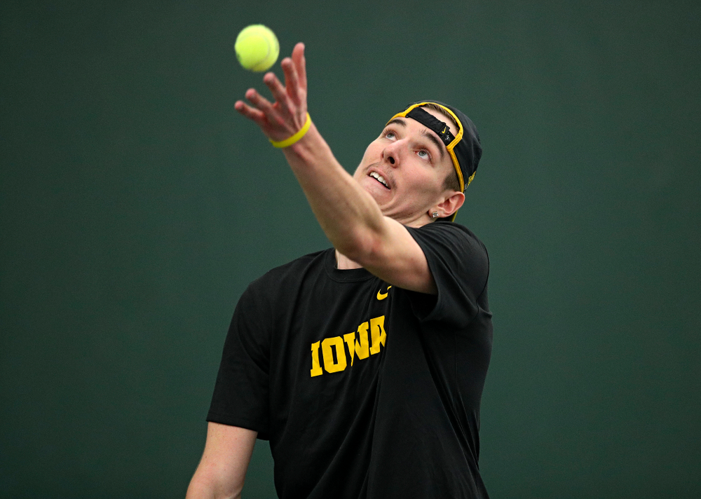 Iowa’s Nikita Snezhko serves during his singles match at the Hawkeye Tennis and Recreation Complex in Iowa City on Friday, March 6, 2020. (Stephen Mally/hawkeyesports.com)