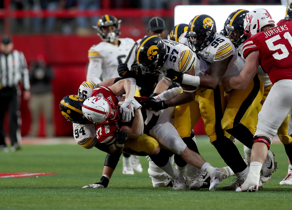 Iowa Hawkeyes defensive end A.J. Epenesa (94), defensive end Chauncey Golston (57), and defensive lineman Cedrick Lattimore (95) against the Nebraska Cornhuskers Friday, November 29, 2019 at Memorial Stadium in Lincoln, Neb. (Brian Ray/hawkeyesports.com)