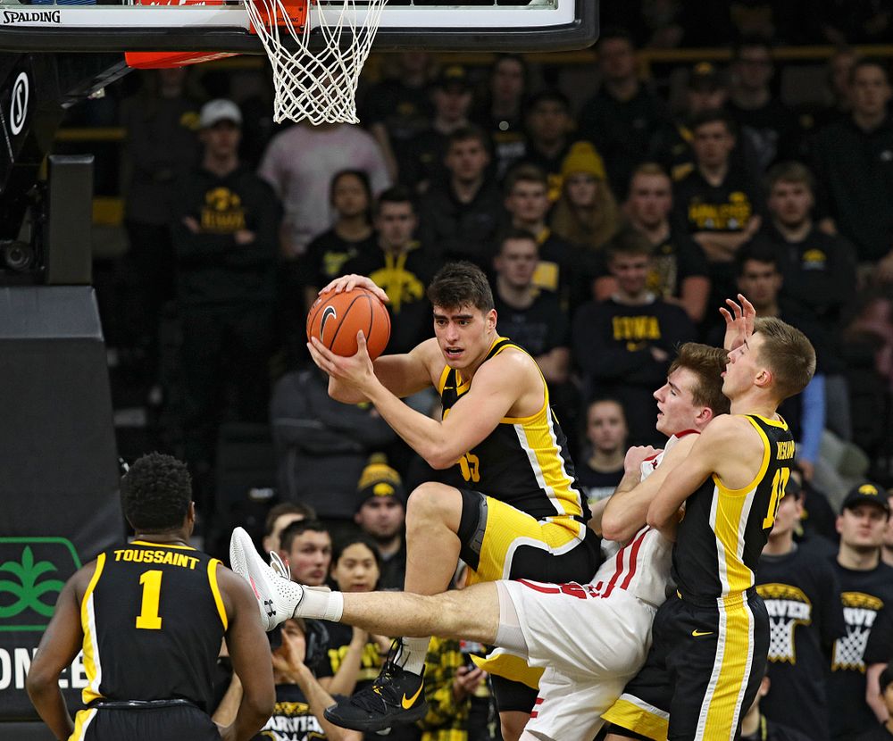 Iowa Hawkeyes center Luka Garza (55) pulls in a rebound during the second half of their game at Carver-Hawkeye Arena in Iowa City on Monday, January 27, 2020. (Stephen Mally/hawkeyesports.com)