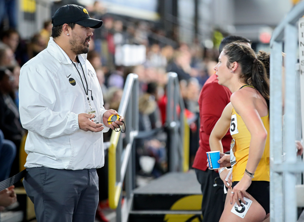 Iowa assistant coach/recruiting coordinator Jason Wakenight (from left) talks with Mallory King and Tia Saunders after they ran the women’s 400 meter dash event during the Larry Wieczorek Invitational at the Recreation Building in Iowa City on Saturday, January 18, 2020. (Stephen Mally/hawkeyesports.com)