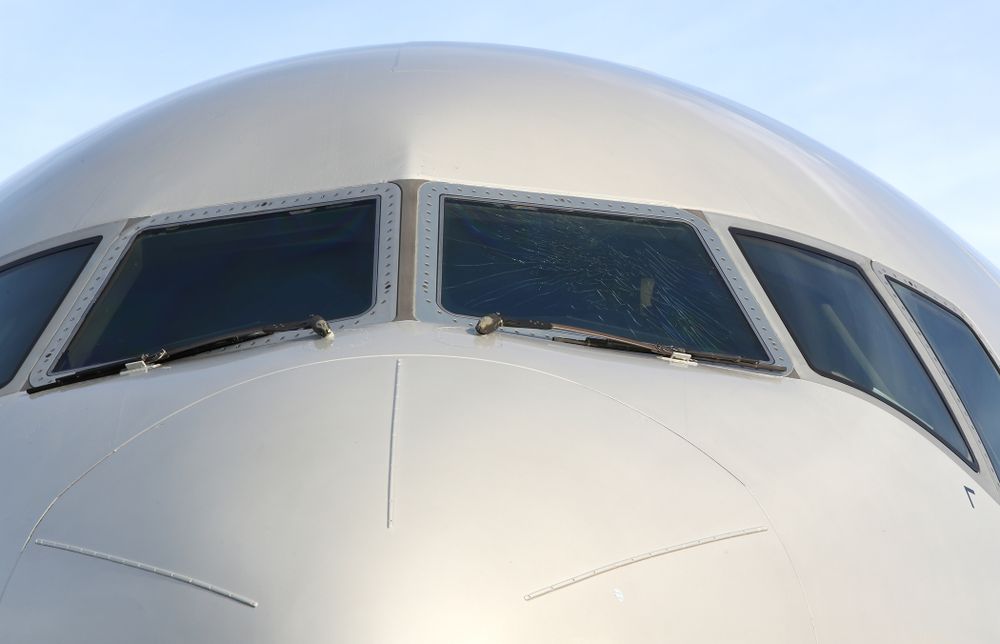 The outer layer of the front windscreen of the team plane is cracked Wednesday, December 26, 2018 as the Iowa Hawkeyes arrive in Tampa, Florida for the Outback Bowl. The flight crew scheduled to take the plane said the damage happened in flight and was due to fatigue from pressure changes in the air. (Brian Ray/hawkeyesports.com)