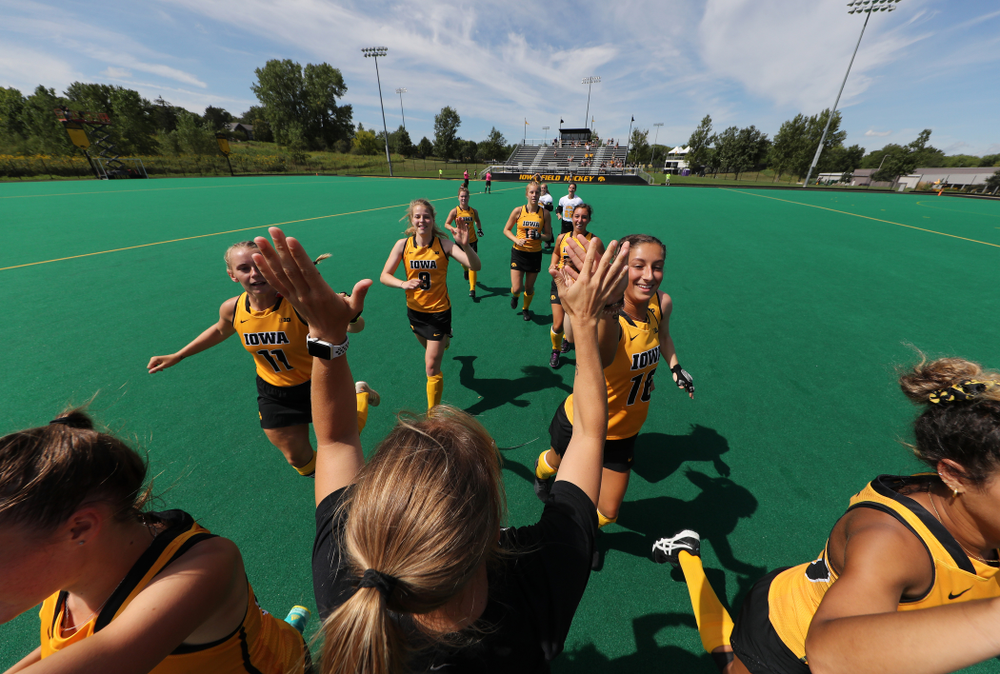 Iowa Hawkeyes Katie Birch (11), Isabella Solaroli (16), and Iowa Hawkeyes assistant coach Roz Ellis during an exhibition game against Northwestern Saturday, August 24, 2019 at Grant Field. (Brian Ray/hawkeyesports.com)