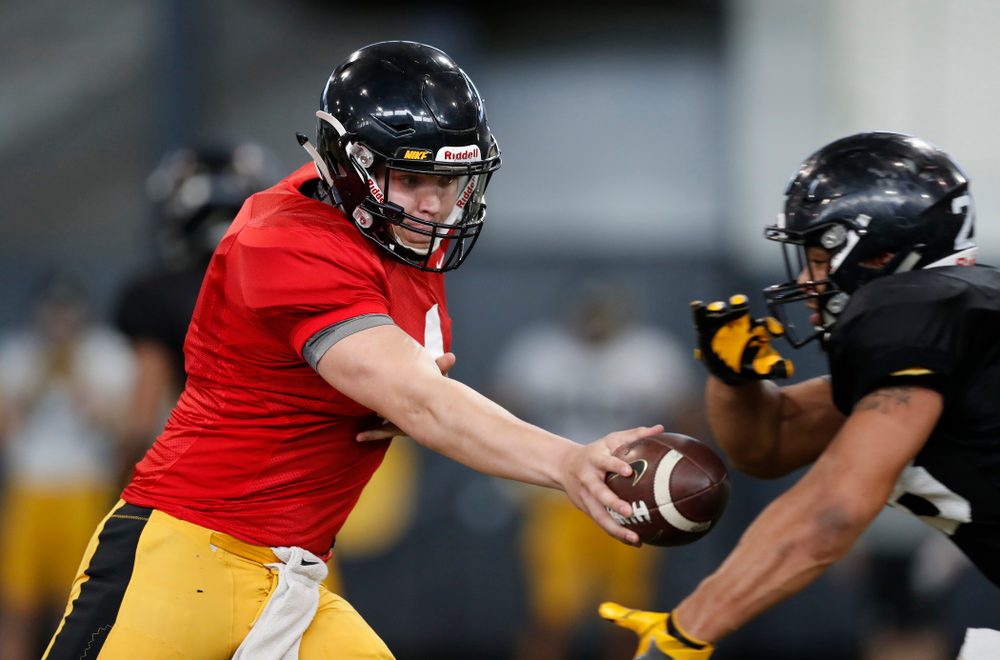 Iowa Hawkeyes quarterback Nathan Stanley (4) and running back Toren Young (28) Wednesday, April 4, 2018 at the Hansen Football Performance Center. (Brian Ray/hawkeyesports.com)