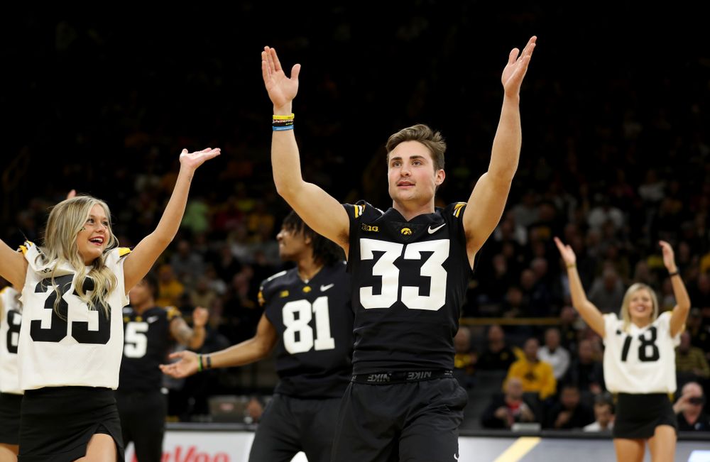 Members of the Hawkeye Football team performs with the Iowa Dance Team at halftime of the Iowa Hawkeyes game against the Ohio State Buckeyes Thursday, February 20, 2020 at Carver-Hawkeye Arena. (Brian Ray/hawkeyesports.com)