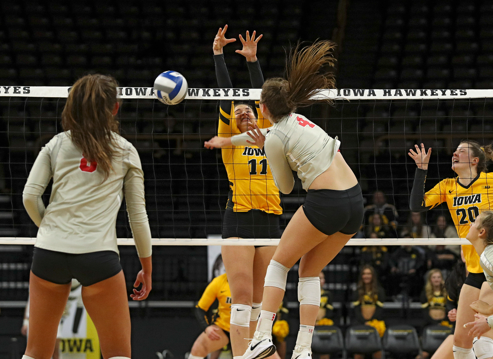 Iowa’s Blythe Rients (11) blocks a shot during the first set of their match at Carver-Hawkeye Arena in Iowa City on Friday, Nov 29, 2019. (Stephen Mally/hawkeyesports.com)