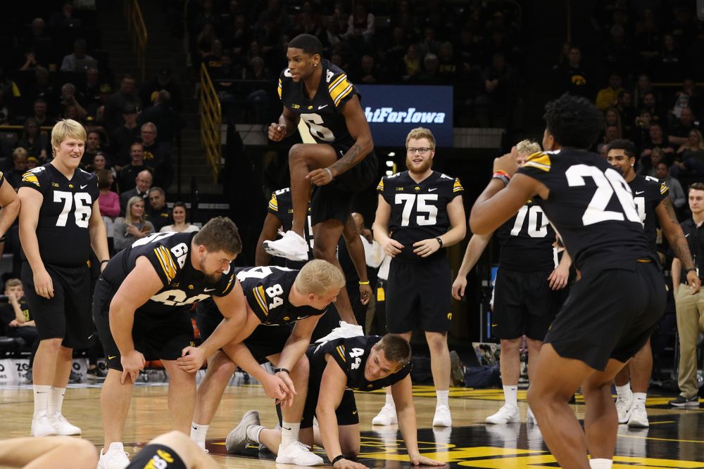 The Iowa Dance Team performs with the Iowa Football Team at halftime of the Iowa Hawkeyes game against the Indiana Hoosiers Friday, February 22, 2019 at Carver-Hawkeye Arena. (Brian Ray/hawkeyesports.com)