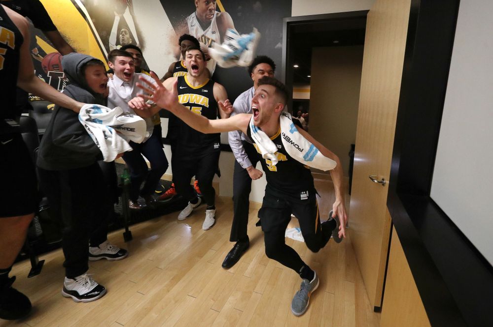 Iowa Hawkeyes guard Jordan Bohannon (3) celebrates with his teammates after defeating the Indiana Hoosiers in overtime Friday, February 22, 2019 at Carver-Hawkeye Arena. (Brian Ray/hawkeyesports.com)
