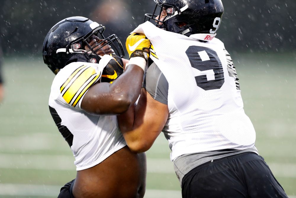 Iowa Hawkeyes defensive end Brandon Simon (93) and defensive end A.J. Epenesa (94) during camp practice No. 15 Monday, August 20, 2018 at the Hansen Football Performance Center. (Brian Ray/hawkeyesports.com)
