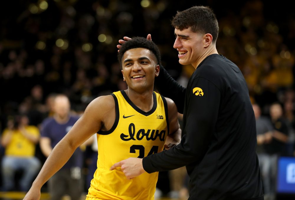 Iowa Hawkeyes guard Nicolas Hobbs (24) celebrates with forward Luka Garza (55) following their win against the Nebraska Cornhuskers Saturday, February 8, 2020 at Carver-Hawkeye Arena. (Brian Ray/hawkeyesports.com)