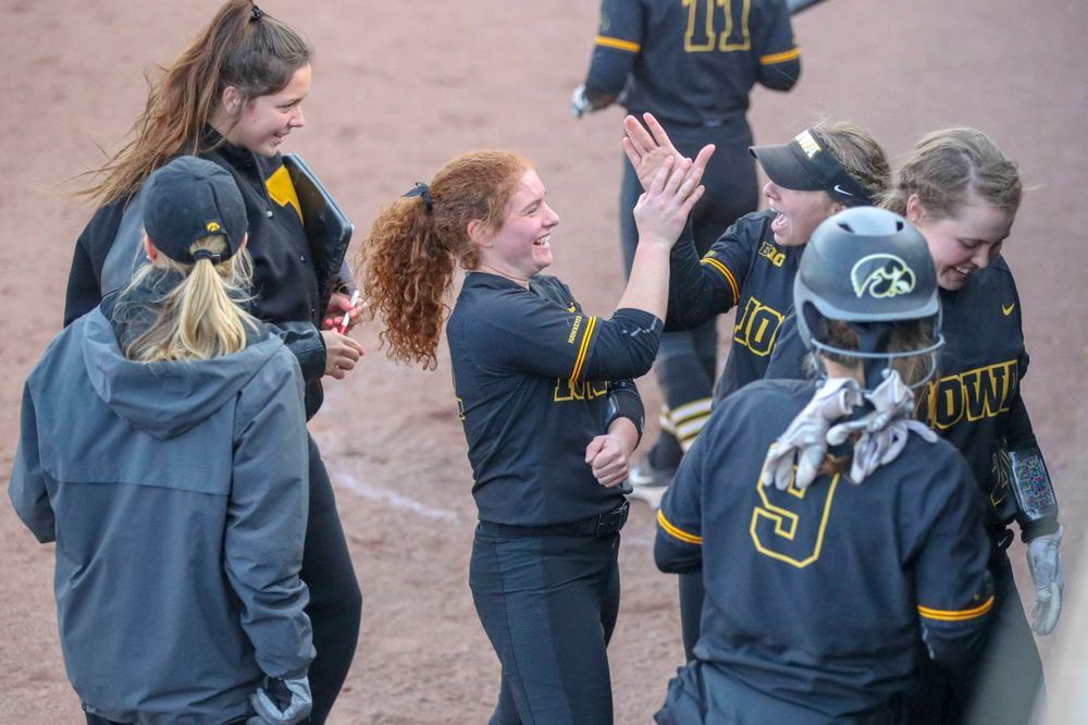 IowaÕs Kate Claypool (12) and IowaÕs Miranda Schulte (20) at softball vs Illinois game 3 on Saturday, April 13, 2019 at Bob Pearl Field. (Lily Smith/hawkeyesports.com)