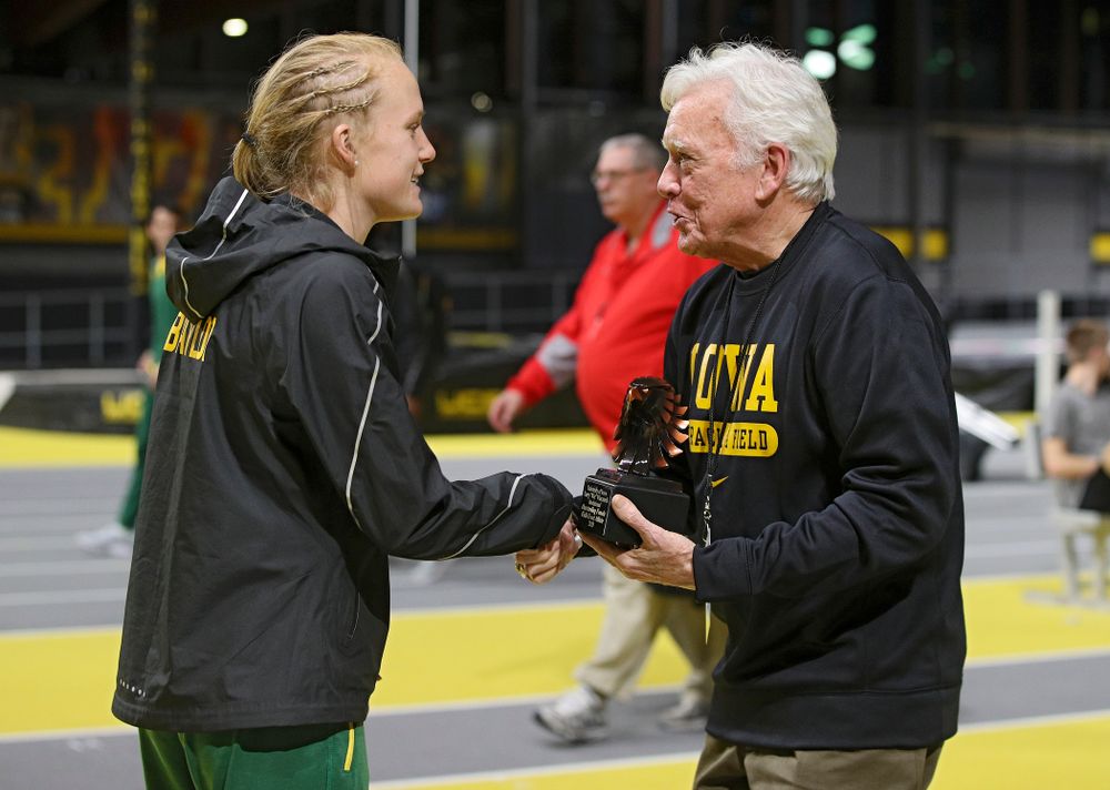 Larry Wieczorek hands out an award during the Larry Wieczorek Invitational at the Recreation Building in Iowa City on Saturday, January 18, 2020. (Stephen Mally/hawkeyesports.com)