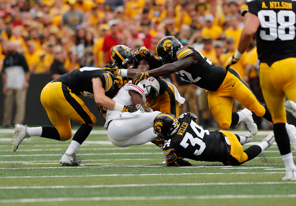 Iowa Hawkeyes linebacker Nick Niemann (49), defensive back Amani Hooker (27), linebacker Amani Jones (52), and linebacker Kristian Welch (34) against the Northern Illinois Huskies Saturday, September 1, 2018 at Kinnick Stadium. (Brian Ray/hawkeyesports.com)