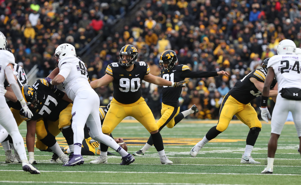 Iowa Hawkeyes place kicker Miguel Recinos (91) and defensive end Sam Brincks (90) against the Northwestern Wildcats Saturday, November 10, 2018 at Kinnick Stadium. (Brian Ray/hawkeyesports.com)