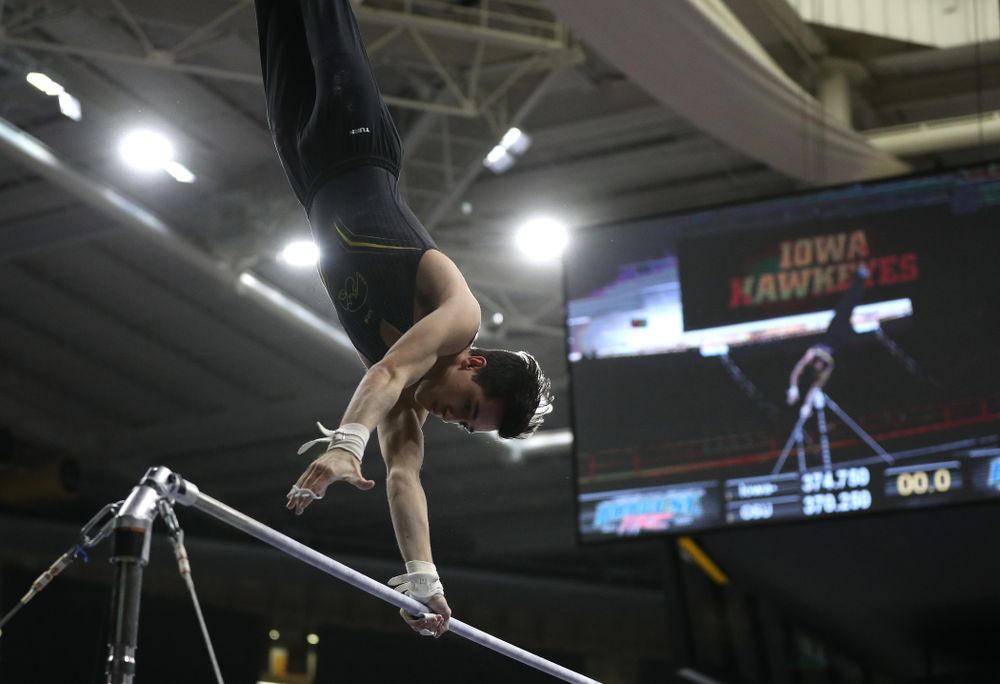 Iowa's Andrew Herrador competes on the high bar against the Ohio State Buckeyes Saturday, March 16, 2019 at Carver-Hawkeye Arena. (Brian Ray/hawkeyesports.com)