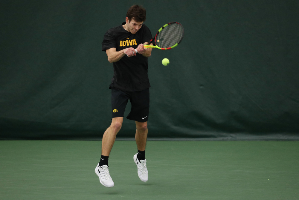 Iowa's Piotr Smietana against UMKC Friday, February 15, 2019 at the Hawkeye Tennis and Recreation Complex. (Brian Ray/hawkeyesports.com)
