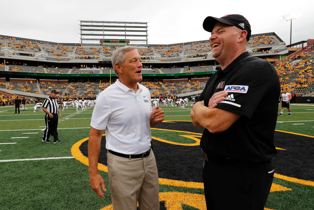Iowa Hawkeyes head coach Kirk Ferentz shakes hands with head coach Rod Carey Saturday, September 1, 2018 at Kinnick Stadium. (Brian Ray/hawkeyesports.com)