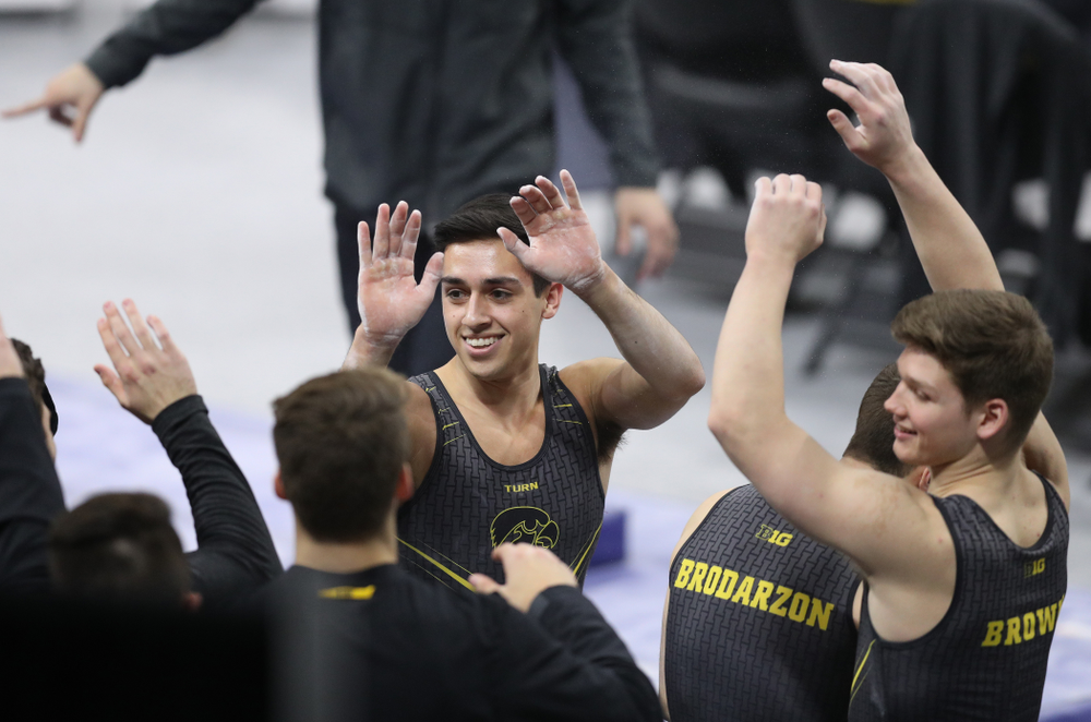 Iowa's Andrew Herrador competes on the parallel bars against Oklahoma Saturday, February 9, 2019 at Carver-Hawkeye Arena. (Brian Ray/hawkeyesports.com)