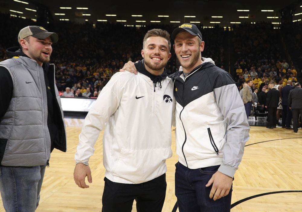 The Hawkeye Football team is introduced during a timeout of the Iowa Hawkeyes game against the Michigan Wolverines Friday, February 1, 2019 at Carver-Hawkeye Arena. (Brian Ray/hawkeyesports.com)