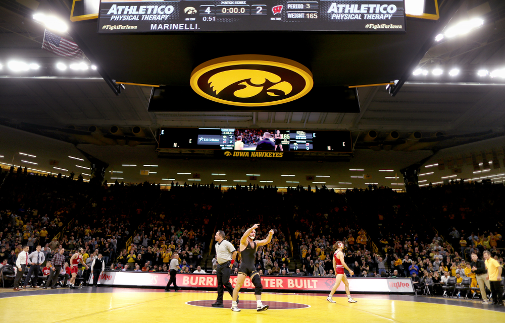 IowaÕs Alex Marinelli celebrates after defeating WisconsinÕs Evan Wick at 165 pounds Sunday, December 1, 2019 at Carver-Hawkeye Arena. Marinelli won the match 4-2. (Brian Ray/hawkeyesports.com)