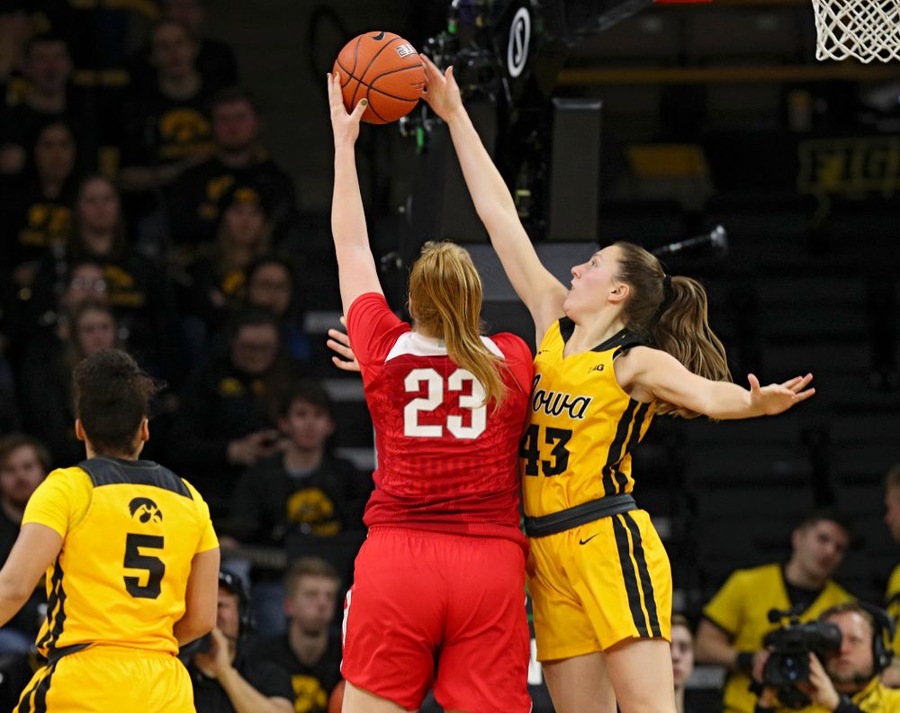 Iowa Hawkeyes forward Amanda Ollinger (43) blocks a shot by Ohio State Buckeyes forward Rebeka Mikulasikova (23) during the third quarter of their game at Carver-Hawkeye Arena in Iowa City on Thursday, January 23, 2020. (Stephen Mally/hawkeyesports.com)